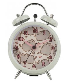 an alarm clock with cartoon cats on it's face and numbers in the middle