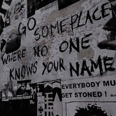 graffiti on the side of a building that says go someplace where no one knows your name