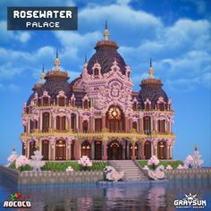 a large building that is in the middle of water and has flowers on it's side