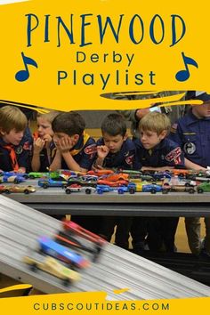 a group of children playing with toy cars on a table and the words pinewood derby playlist above them