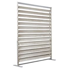 a white metal rack with six rows of shelves on each side and one section closed