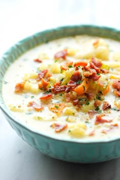 a bowl filled with soup and topped with bacon