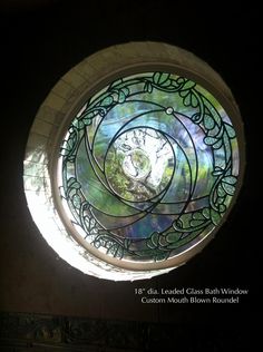 a circular stained glass window in the center of a room