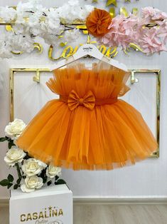 Pamela Dress Orange. Baby Girl Dress. Birthday Dress. This dress is designed to make your baby girl feel comfortable and stylish throughout the day. The soft and breathable fabric ensures that she can move freely and comfortably, while the intricate lace and tulle details add a touch of sophistication. The combination of the vibrant orange color and the delicate textures creates a truly eye-catching and unique look. Perfect for birthdays and special occasions, this dress will make your little one the center of attention. The vibrant orange color exudes joy and happiness, creating a cheerful and celebratory atmosphere. The knee-length silhouette is both cute and practical, allowing your baby girl to move and play with ease. To complete the look, pair this dress with some cute accessories su Birthday Photoshoot Dress, Kids Dress Collection, Sparkly Bracelets, Orange Baby, Dress Birthday, Photoshoot Dress, Dress Orange, Birthday Dress, Lilac Color