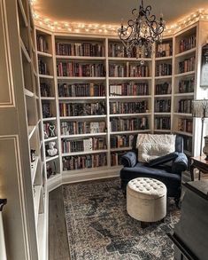 a living room filled with furniture and lots of bookshelves full of books on top of them