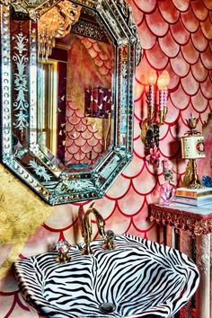 a bathroom with a zebra print sink and mirror