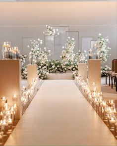 a long table with candles and flowers on it