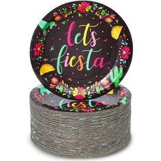 two black plates with colorful flowers and let's fiesta written on the front one