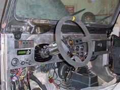 the inside of a car with various electronics and wires in it's dash board