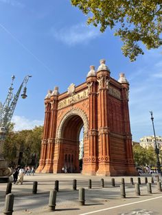 an old brick arch in the middle of a city