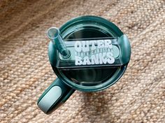 an overhead view of a glass cup with the words outer limits banks printed on it