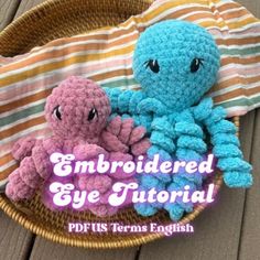 two crocheted octopus stuffed animals in a basket