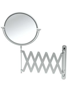 a round mirror is next to a metal rack