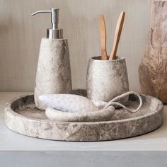 marble bathroom accessories displayed on counter top