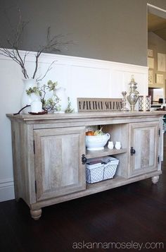 a large wooden cabinet sitting on top of a hard wood floor