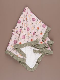 Let your little flower bloom in our Bloomberry Fields collection, featuring soft pastels, bold stripes, and floral patterns that evoke the beauty of a spring garden. Each garment is made of a high-quality material that ensures comfort, durability, and longevity. Our hand-drawn Bloomberry Fields print features gorgeous florals and incorporates polka dots & stripes with elbow patches in the full collection. This sweet blanket features one soft minky side & our Bloomberry Fields print on the other Stripes And Floral, Bold Stripes, Minky Blanket, Elbow Patches, Spring Garden, Floral Patterns, Soft Pastel, Floral Pattern, Hand Drawn