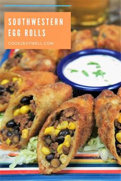 southwestern egg rolls with corn and black beans on a colorful plate next to ranch dip