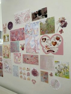 a wall covered in lots of different pictures and stickers on it's side