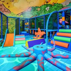 an inflatable water park with slides and toys