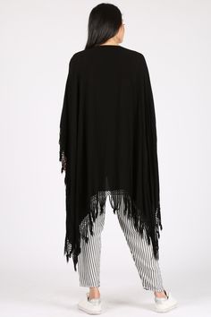 A light take on the poncho, this versatile piece can also act as a shawl and beach coverup. Please note this style is unisex. Fabric Content: 60% Cotton, 40% Rayon, made in Morocco. Sizing: O/S Casual Beach Shawl For Summer, Casual Summer Shawl For Beach, Casual Summer Beach Shawl, Spring Beach Shawl Poncho, Black Beach Poncho One Size, Bohemian Shawl For Beach In Summer, Bohemian Shawl For Summer Beach, Bohemian Shawl For Summer Beach Outing, Black One Size Beach Poncho