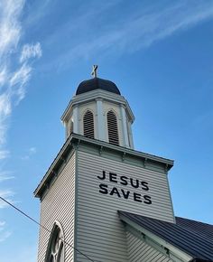 a church steeple with the words jesus saves written on it