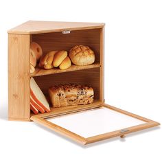 an open wooden box with bread and pastries on the shelf in front of it