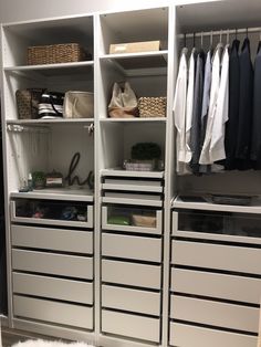 an organized closet with drawers and clothes