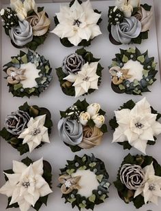 the cupcakes are decorated with flowers and leaves