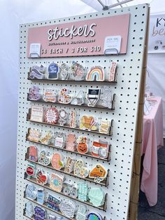 there is a sign that says stickers on the wall and it's for sale