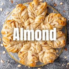 almond pastries on a plate with the word almond over it that says almonds