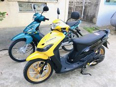 two motorcycles are parked next to each other