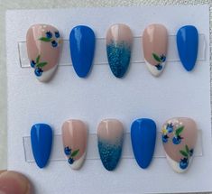 Absolutely obsessed with the fruit theme! These nails feature the cutest blueberries over French tips and a glittery ombré nail. This set is shown on short almonds.   Each set comes with nail glue, a mini buffer block, a cuticle pusher and an alcohol wipe for optimal prep before applying the nails. All products used are Beetles gel polish brand. Avoid inhalation, ingestion, and eye contact. If irritation or allergic signs occurs, stop use immediately. If signs persist, seek medical attention. Keep out of reach of children. Refer to Beetles' products for further product information and ingredients. Beetles Gel Polish, Gel Polish Brands, Fruit Nails, Crochet Princess, Cuticle Pusher, French Tips, Acrylic Press On Nails