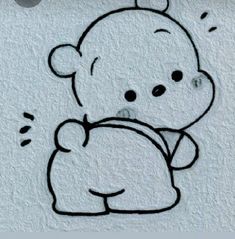 a drawing of a teddy bear on the wall