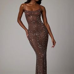 a woman in a long dress with sequins on it