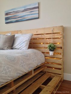 a bed made out of wooden pallets in a bedroom