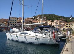 a sailboat is docked in the harbor