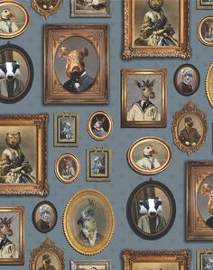 a wall with many framed pictures and animals on it's sides, all in gold frames