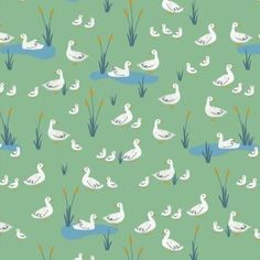 a green background with white ducks and reeds