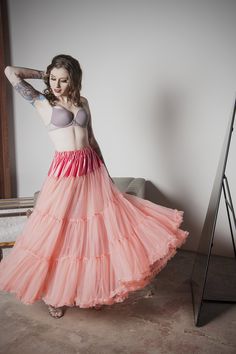 This is the petticoat to shame all others. Delight in the fluff without the crisp, stiff feel typical of most. One Size fits up to 10. Notes:This style does have bulk at the waist, making it a good match for only natural-waisted or empire gowns with gathers at the waist. Approx 60 day delivery. Fitted Pink Tulle Bottoms, Spring Can-can Petticoat In Crinoline, Flowy Full Petticoat With Ruffles, Flowy Tiered Petticoat With Attached Cancan, Voluminous Ruffled Petticoat, Pink Tiered Petticoat With Attached Cancan, Can-can Crinoline Petticoat With Tiered Skirt, Can-can Crinoline Tiered Petticoat, Spring Flared Stretch Petticoat