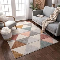 a living room filled with furniture and a rug