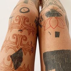 a person with tattoos on their legs