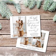 two christmas cards with the same photo on them and pine branches in front of them