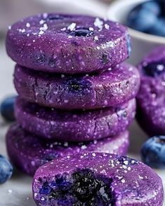 blueberry donuts are stacked on top of each other