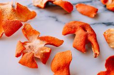 peeled orange peels on a marble surface