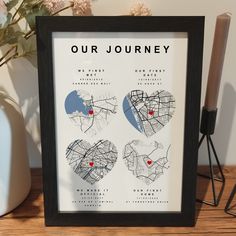 a black framed poster with three hearts on it and the words our journey written in red