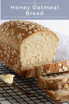 a loaf of honey oatmeal bread sitting on top of a cooling rack