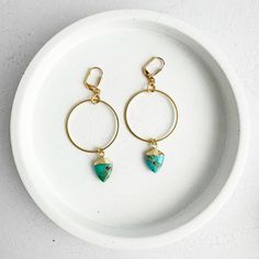 Featuring gold hoop pendants adorned with turquoise shield stones, these statement earrings add a touch of fun and personality to your outfits. · Turquoise · Gold plating on brass · Leverback clasp · 2.75" drop Gems Jewelry, Gold Earrings Dangle, Jewelry Earrings Hoops, Gold Hoop, Bracelet Stack, Gold Hoop Earrings, Cocktail Rings, Ring Bracelet, Gold Plating