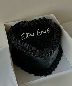 a heart shaped cake in a box with the word star guide on it's side