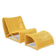 pair of yellow wicker lounge chairs on white background