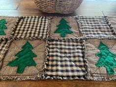 a basket sitting on top of a wooden floor next to a christmas tree quilted placemat